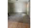 Living room with wall-to-wall carpeting at 10007 N 26Th St, Tampa, FL 33612
