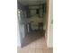 Dated kitchen with wood cabinets and tiled floor at 10007 N 26Th St, Tampa, FL 33612