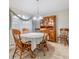 Cozy dining area featuring a wooden table and hutch at 6928 Stephens Path, Zephyrhills, FL 33542