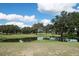 Picturesque golf course with pond and oak trees at 6928 Stephens Path, Zephyrhills, FL 33542