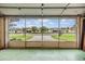 Garage with screened windows overlooking neighborhood at 6928 Stephens Path, Zephyrhills, FL 33542