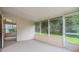 Relaxing screened porch overlooking a lush green backyard at 6928 Stephens Path, Zephyrhills, FL 33542