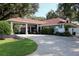 Clubhouse with covered carport and golf cart parking at 6928 Stephens Path, Zephyrhills, FL 33542
