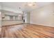 Open living area with hardwood floors and kitchen views at 6928 Stephens Path, Zephyrhills, FL 33542