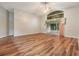 Spacious living area with hardwood floors and sliding glass doors at 6928 Stephens Path, Zephyrhills, FL 33542