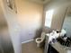 Clean bathroom with toilet and vanity at 3316 Thistledown Ln, Land O Lakes, FL 34638