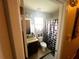 Clean bathroom with a shower/tub combo and neutral decor at 3316 Thistledown Ln, Land O Lakes, FL 34638