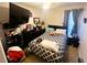 Cozy bedroom with double bed and large TV at 3316 Thistledown Ln, Land O Lakes, FL 34638