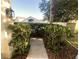 Sidewalk leading to the entrance with landscaping at 3316 Thistledown Ln, Land O Lakes, FL 34638