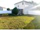 Backyard with screened patio and grassy area at 3316 Thistledown Ln, Land O Lakes, FL 34638