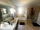 Bathroom with bathtub, shower, and double vanity at 3316 Thistledown Ln, Land O Lakes, FL 34638