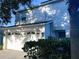 Two-story house with a two-car garage and landscaping at 3316 Thistledown Ln, Land O Lakes, FL 34638