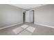 Clean bedroom featuring tile floors, neutral paint, baseboard trim, and natural light creating an airy atmosphere at 4717 Blue Star Ct, North Port, FL 34289