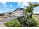 Charming single-Gathering home featuring a well-manicured lawn, paver driveway and a two-car garage at 4717 Blue Star Ct, North Port, FL 34289