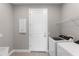 Laundry room with washer, dryer, and ample shelving at 4717 Blue Star Ct, North Port, FL 34289