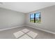 Spacious bedroom with large window and tile flooring at 4717 Blue Star Ct, North Port, FL 34289