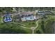 Resort-style pool, tennis courts, and parking area at 4717 Blue Star Ct, North Port, FL 34289