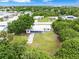 An aerial view showcasing a cozy house with landscaping and other homes in the area at 801 Brodhag Dr, Punta Gorda, FL 33950