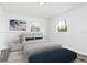 A neutral bedroom showcasing natural lighting and minimalist decor at 801 Brodhag Dr, Punta Gorda, FL 33950