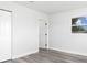 Well-lit room with white walls, gray floors, and natural light at 801 Brodhag Dr, Punta Gorda, FL 33950