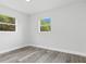 Bedroom featuring two windows providing lots of natural light at 801 Brodhag Dr, Punta Gorda, FL 33950