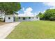 Charming single-story home featuring a spacious yard, covered patio, and bright, neutral paint at 801 Brodhag Dr, Punta Gorda, FL 33950