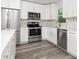 Stylish kitchen featuring stainless steel appliances and white cabinetry at 801 Brodhag Dr, Punta Gorda, FL 33950