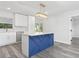 Bright kitchen featuring a large island, stainless appliances, and modern lighting at 801 Brodhag Dr, Punta Gorda, FL 33950