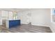 Open-concept living area with kitchen island and wood-look flooring at 801 Brodhag Dr, Punta Gorda, FL 33950