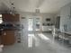 Modern kitchen with island and breakfast bar, opens to dining area at 10520 Henderson Rd, Tampa, FL 33625