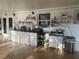 Outdoor kitchen with granite countertops and white cabinets at 10520 Henderson Rd, Tampa, FL 33625