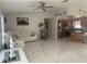 Spacious living room with white sectional sofa and marble floors at 10520 Henderson Rd, Tampa, FL 33625