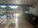 Relaxing screened porch with outdoor seating and pond view at 10520 Henderson Rd, Tampa, FL 33625