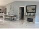 Elegant dining room with a modern fireplace and glass table at 10520 Henderson Rd, Tampa, FL 33625