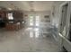 Open concept kitchen with marble floors and modern appliances at 10520 Henderson Rd, Tampa, FL 33625