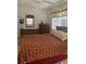 Bedroom with double bed and wicker furniture at 90 144Th Ave # 7, Madeira Beach, FL 33708