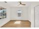 Well-lit bedroom with hardwood floors and a ceiling fan at 1207 E 17Th Ave, Tampa, FL 33605