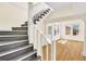 White railing staircase with dark grey steps and views to living room at 1207 E 17Th Ave, Tampa, FL 33605