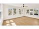 Bright living room with hardwood floors and large windows providing ample natural light at 1207 E 17Th Ave, Tampa, FL 33605