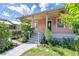Inviting house exterior showcasing a freshly painted facade and lush landscaping at 1207 E 17Th Ave, Tampa, FL 33605