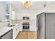 Modern kitchen with white cabinets, quartz countertops, and stainless steel appliances at 1207 E 17Th Ave, Tampa, FL 33605