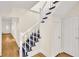 Staircase with white railing and dark grey steps leading to the second floor at 1207 E 17Th Ave, Tampa, FL 33605