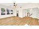 Spacious living area with hardwood floors and views into the kitchen and upstairs at 1207 E 17Th Ave, Tampa, FL 33605