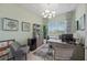Home office with built-in shelving and window seat at 13576 Boatbill Ln, Port Charlotte, FL 33981