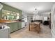 Eat-in kitchen with green cabinets and tile floors at 16637 Livingston Ave, Lutz, FL 33559