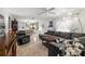 Open living area with sectional sofa and hardwood floors at 16637 Livingston Ave, Lutz, FL 33559