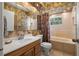 Clean bathroom with a bathtub, toilet and sink at 16637 Livingston Ave, Lutz, FL 33559
