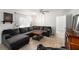 Spacious living room with sectional sofa and large TV at 16637 Livingston Ave, Lutz, FL 33559