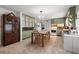 Bright kitchen with ample cabinetry and a dining area at 16637 Livingston Ave, Lutz, FL 33559