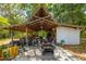 Large covered workshop with various equipment and tools at 16637 Livingston Ave, Lutz, FL 33559